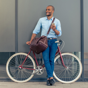 15 Easy Tips to Save Money Every Day Man riding bike to work