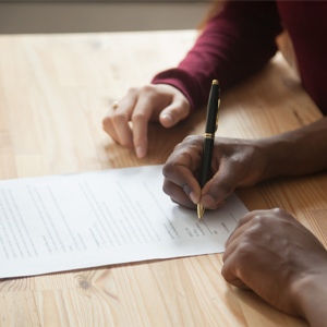 5 Reasons Why You Need to Protect Yourself with Renter's Insurance Signing papers