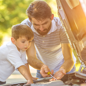 Summer Car Care Father and son working on car